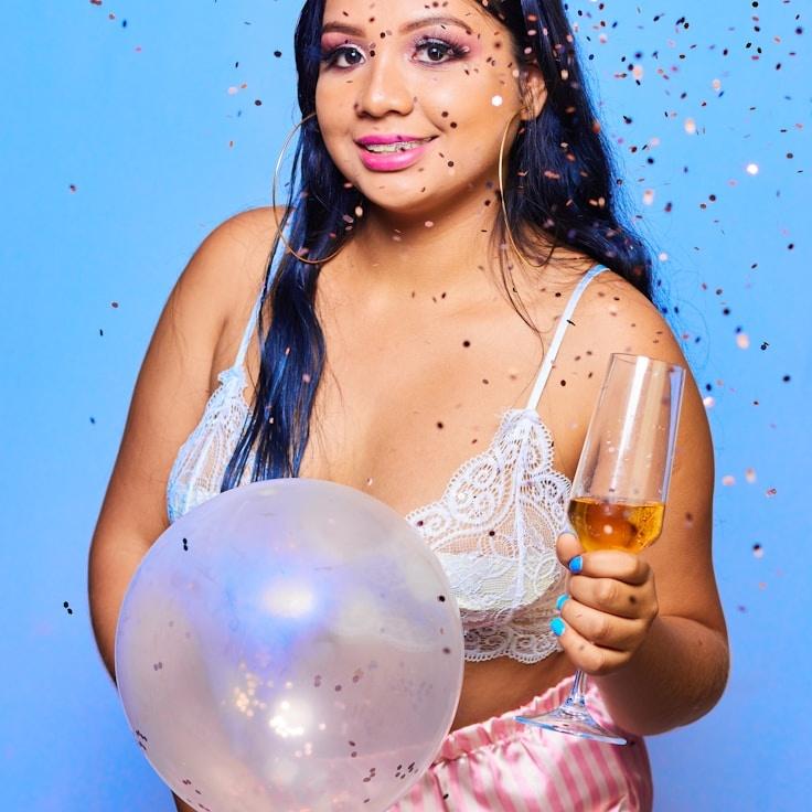 Kaveri Mehta, Lead Design Curator at Ridge Cottage Ember, reviewing corporate floral arrangements